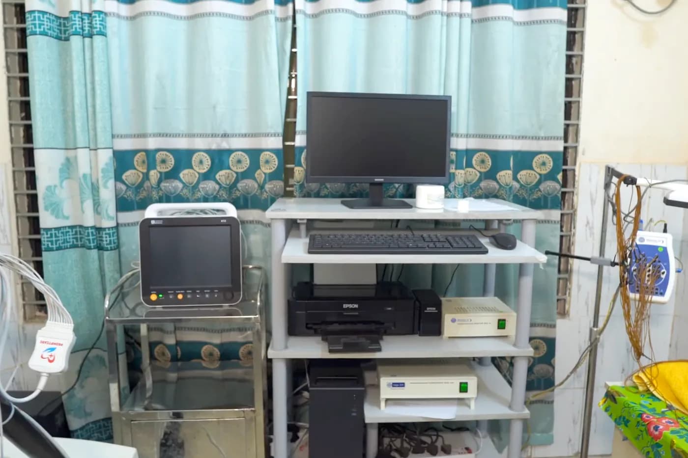 Exercise tolerance test room with treadmill and monitoring equipment at Dhaka Clinic, Tangail