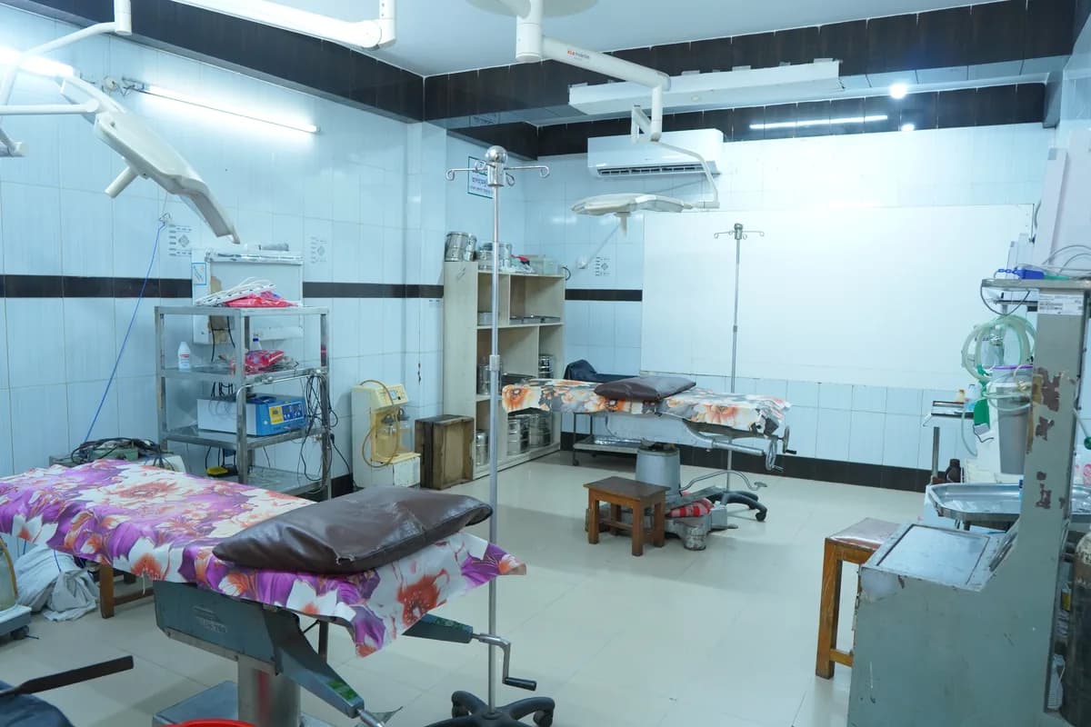 A theatre room with overhead lighting and monitoring equipment at Dhaka Clinic, Tangail