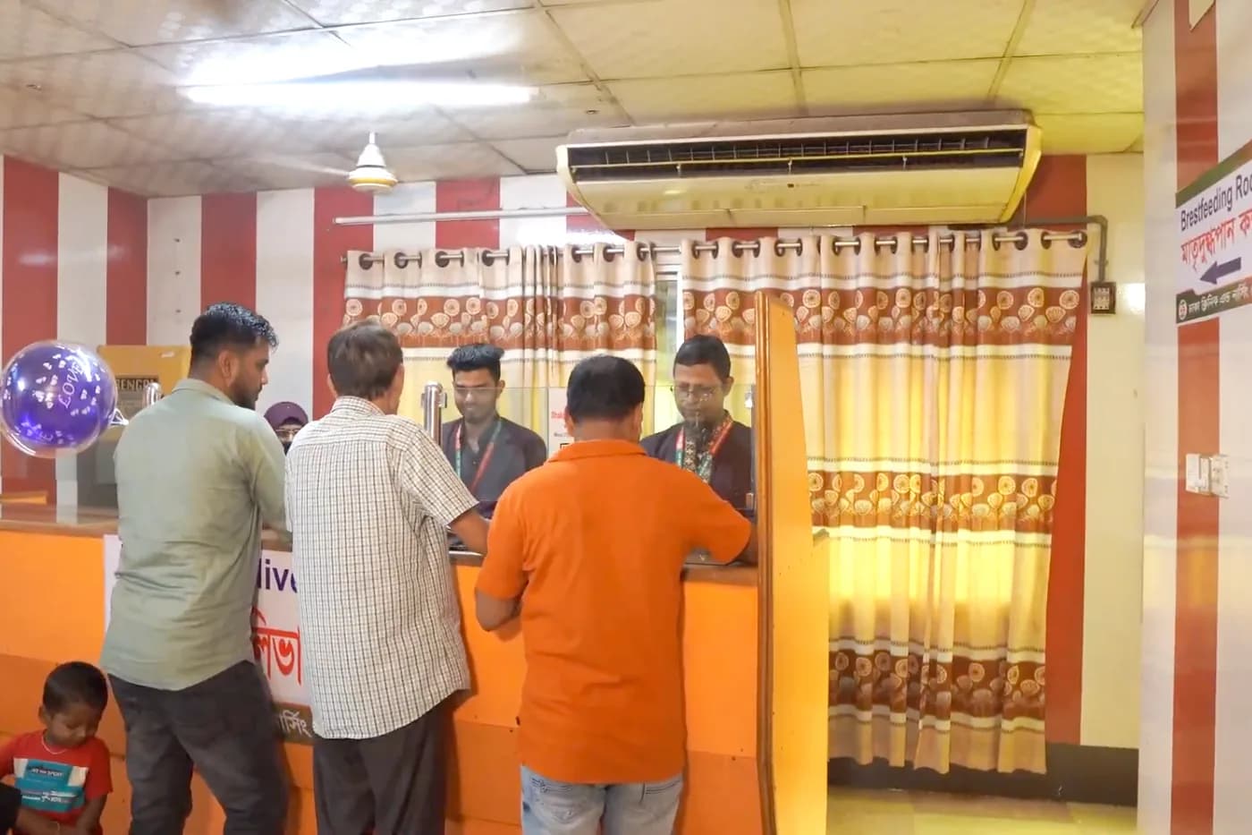 Patients collecting diagnostic reports at the report delivery counter, Dhaka Clinic, Tangail