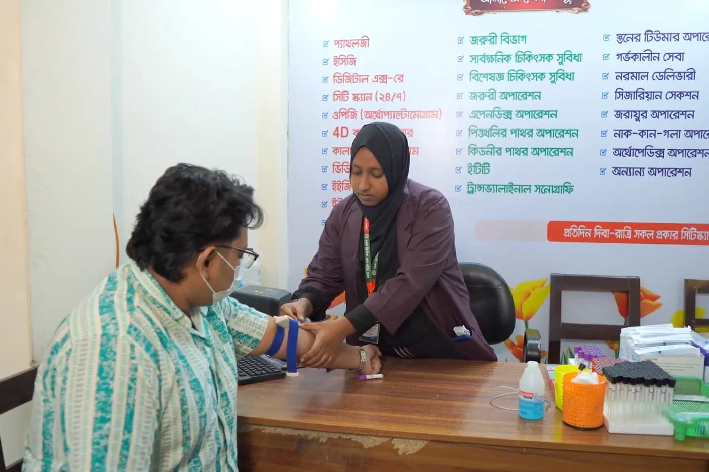 Blood sample being collected at Dhaka Clinic, Tangail