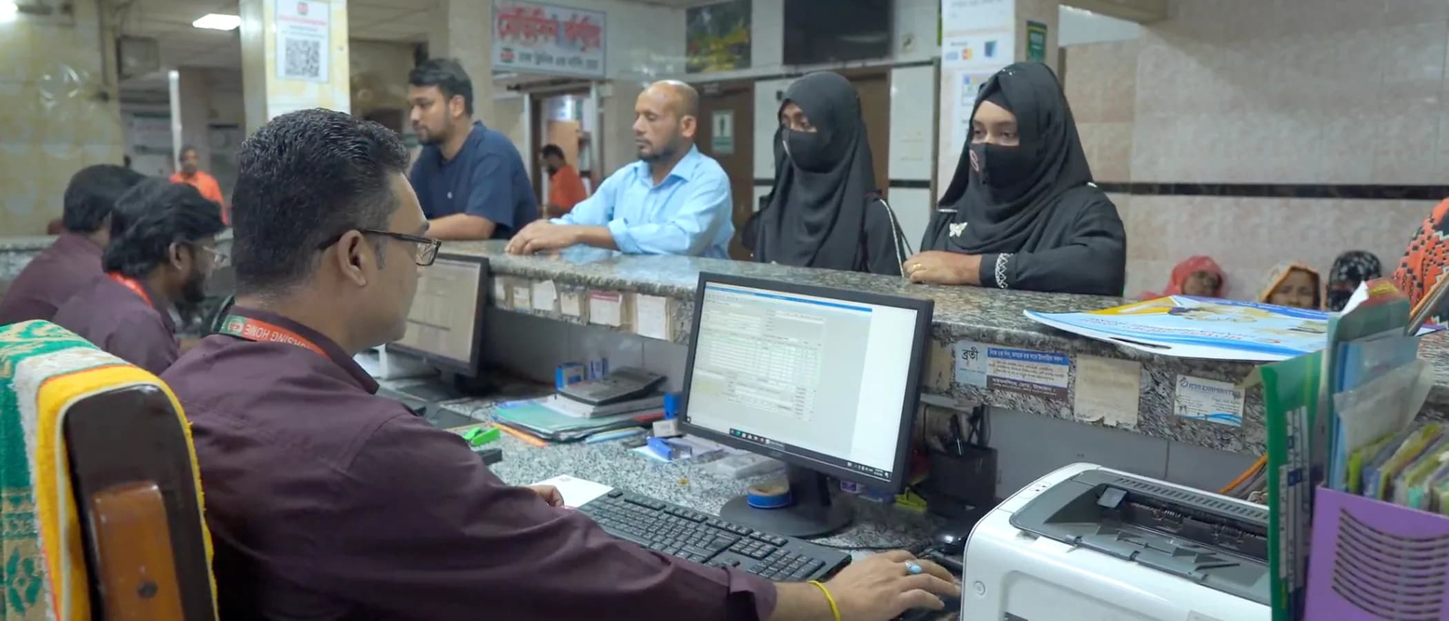 The reception and records counter in use at the Dhaka Clinic & Nursing Home main branch, Tangail